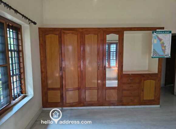 Built-in wardrobe in bedroom made of teakwood