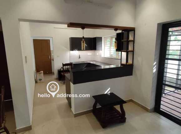 Open kitchen with breakfast counter and cabinets