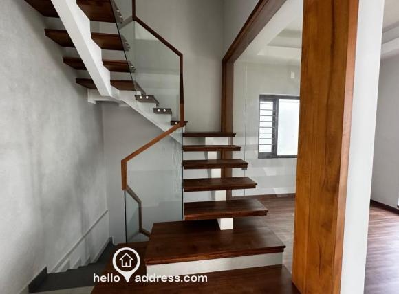 Stairs completed with teak wood and premium glass giving a modern yet homely finish.