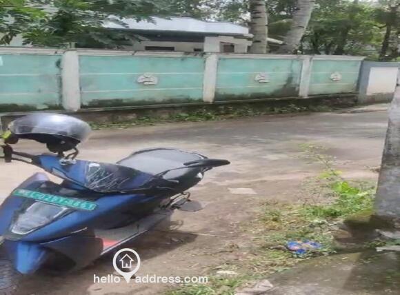 parked bike on road in front of land